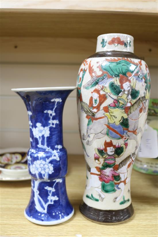 A Chinese blue and white Gu vase, decorated with prunus blossom and a crackleware vase, H 20cm & 29cm